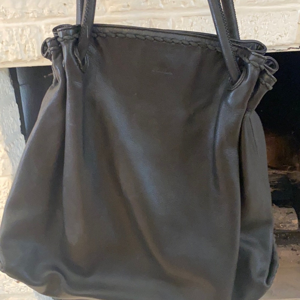 Good used condition. Black Furla leather hobo bag.